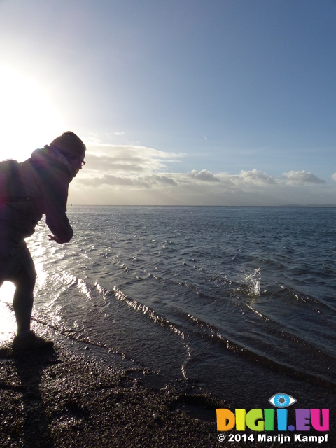 FZ010582 Jenni skipping stones from Exmouth beach